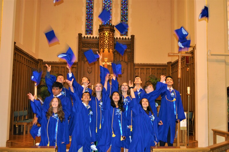 The class of 2021 throwing their caps in the air